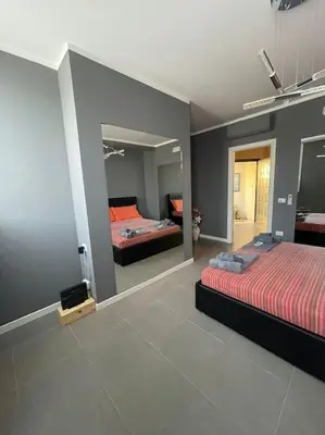 Letto o letti in una camera di ERMAN HOUSE Perla nera veneziana