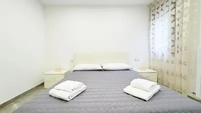 Letto o letti in una camera di Casa Venturini by Ca-Sa Check