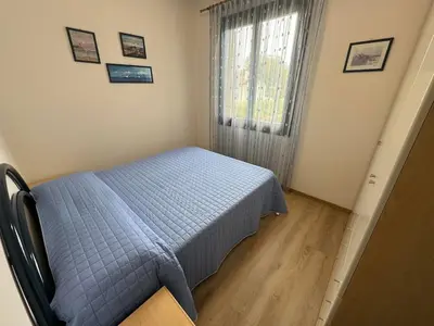 Letto o letti in una camera di App4rent Residence Gaia 12 - in centro, con piscina, posto auto...