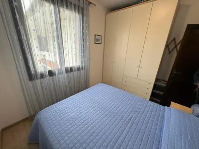 Letto o letti in una camera di App4rent Residence Gaia 12 - in centro, con piscina, posto auto...