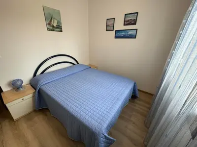 Letto o letti in una camera di App4rent Residence Gaia 12 - in centro, con piscina, posto auto...