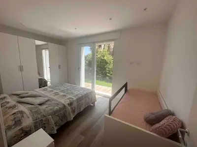 Letto o letti in una camera di Villa Garbisa al Lido di Venezia