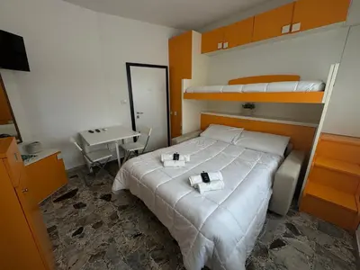 Letto o letti in una camera di Host in Italy - 200m from the sea, beach place included
