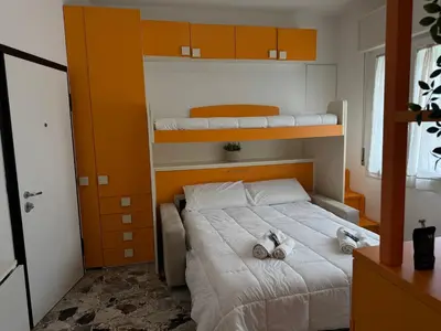 Letto o letti in una camera di Host in Italy - 200m from the sea, beach place included