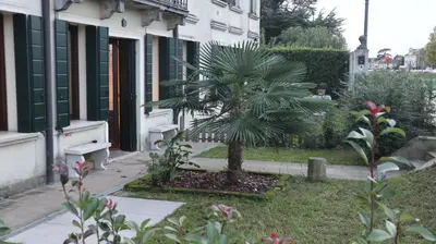 Giardino di Loft Laguna, la tua casa in Riviera