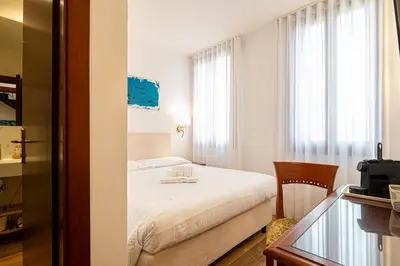 Letto o letti in una camera di Alloggi Marinella