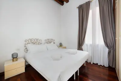 Letto o letti in una camera di San Marco Canal View by Bricola Apartments