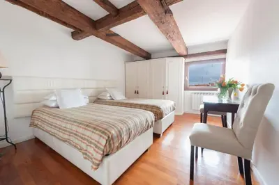 Letto o letti in una camera di Ca' Fortuny, your nest on San Marco rooftops