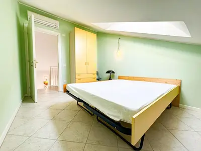 Letto o letti in una camera di Piscina - RESIDENCE ANTENORE