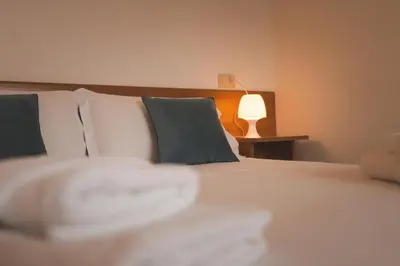 Letto o letti in una camera di Residenza Sant'Antonio - Sottomarina