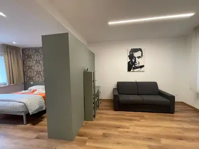 Letto o letti in una camera di PIO X Apartments Treviso