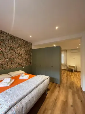 Letto o letti in una camera di PIO X Apartments Treviso