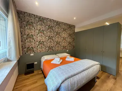 Letto o letti in una camera di PIO X Apartments Treviso