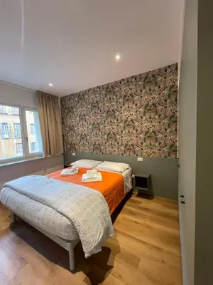 Letto o letti in una camera di PIO X Apartments Treviso