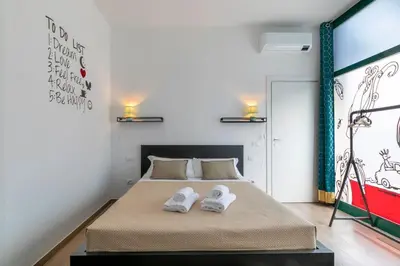 Letto o letti in una camera di Ca' Dandy Small by WelcHome