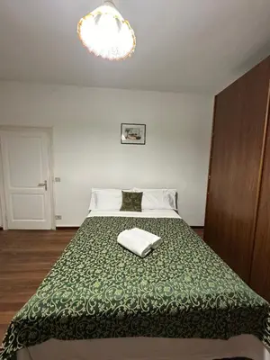 Letto o letti in una camera di Arham Guesthouse Bembo 11