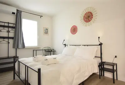 Letto o letti in una camera di Welc-ōM Padova Panta Rei rooms