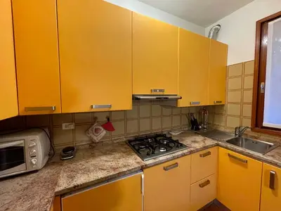 Cucina o angolo cottura di Appartamento VILLA ALBA nel cuore della Pineta