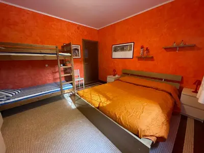 Letto o letti in una camera di Appartamento VILLA ALBA nel cuore della Pineta