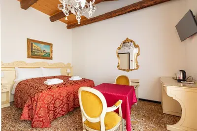 Letto o letti in una camera di Ca' Luisa