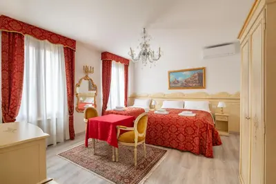Letto o letti in una camera di Ca' Luisa