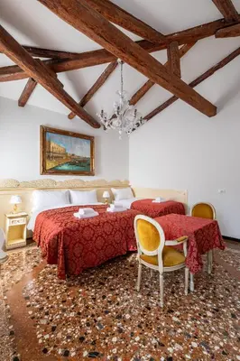 Letto o letti in una camera di Ca' Luisa