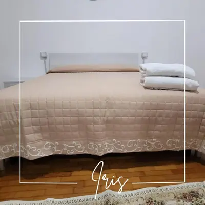 Letto o letti in una camera di Corte Azzurra