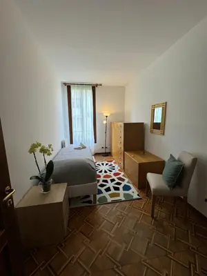 Letto o letti in una camera di Appartamento Villa Trento