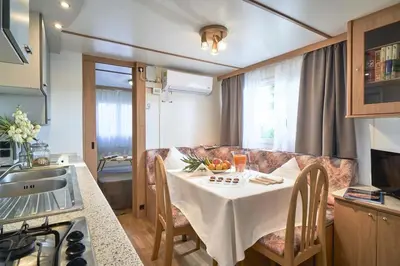 Cucina o angolo cottura di Feriendorf Oasi Mobilehome Maui für 5 Personen
