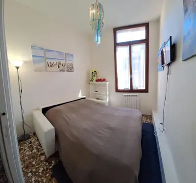 Letto o letti in una camera di Ca' Trapolin Venezia WIFI center city 520