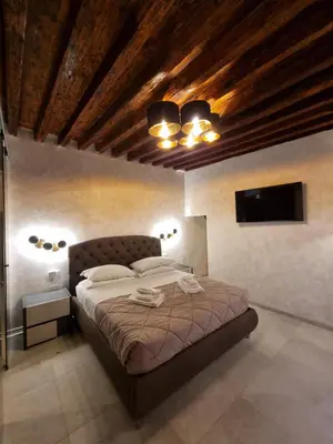 Letto o letti in una camera di San Marco 3097 - LuxuryJacuzzi