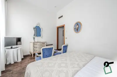 Letto o letti in una camera di HOTIDAY Room Collection - Venezia Santa Lucia