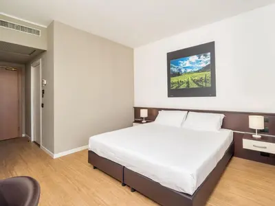 Letto o letti in una camera di B&B HOTEL Eurorest Conegliano