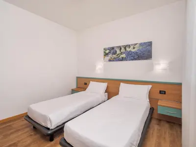 Letto o letti in una camera di B&B HOTEL Eurorest Conegliano
