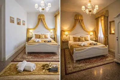 Letto o letti in una camera di Palazzo Titti Rialto Suites