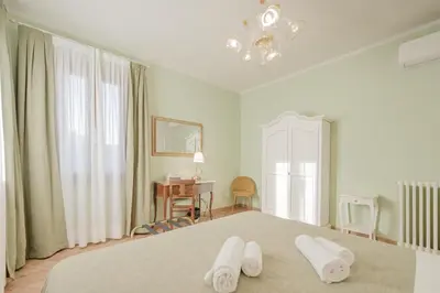 Letto o letti in una camera di Santo Stefano Palace