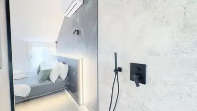Letto o letti in una camera di Graceful Apartments Hell Apartment by Ca-Sa Check