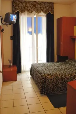 Letto o letti in una camera di Hotel Lido