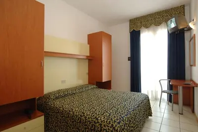 Letto o letti in una camera di Hotel Lido