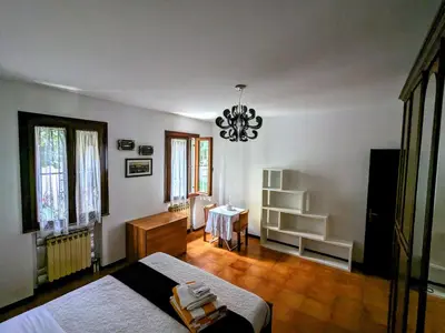 Letto o letti in una camera di Casa singola con spazio auto e giardino