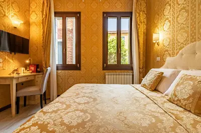 Letto o letti in una camera di Cà Beatrice