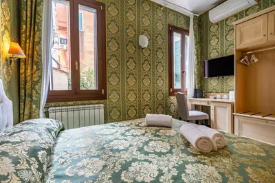 Letto o letti in una camera di Cà Beatrice