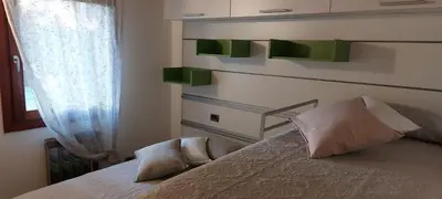 Letto o letti in una camera di Ca' SVIZZERO