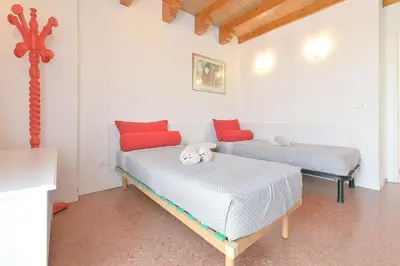 Letto o letti in una camera di Queen Home Beauty