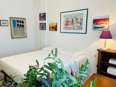 Letto o letti in una camera di Thalia Venezia appartamento accogliente