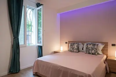Letto o letti in una camera di EnJoy Home - Appartamento elegante con giardino