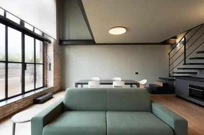 Area soggiorno di Venice Penthouse - Loft with Canal View