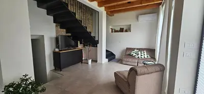 Area soggiorno di Casa Ulivo - Il Brolo Holiday Homes