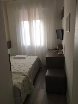 Letto o letti in una camera di Albergo Rosa