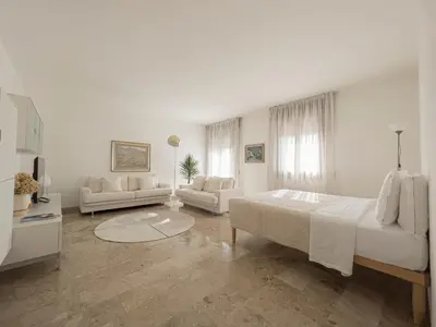 Letto o letti in una camera di Appartamento con vista città vicino Stazione di Mestre 10 min da Venezia